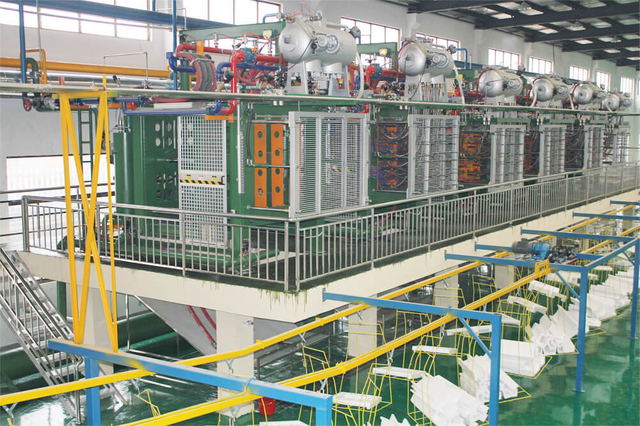 Technicians at Nanjing Skyworth Electrical Packaging configuring advanced packaging machinery
